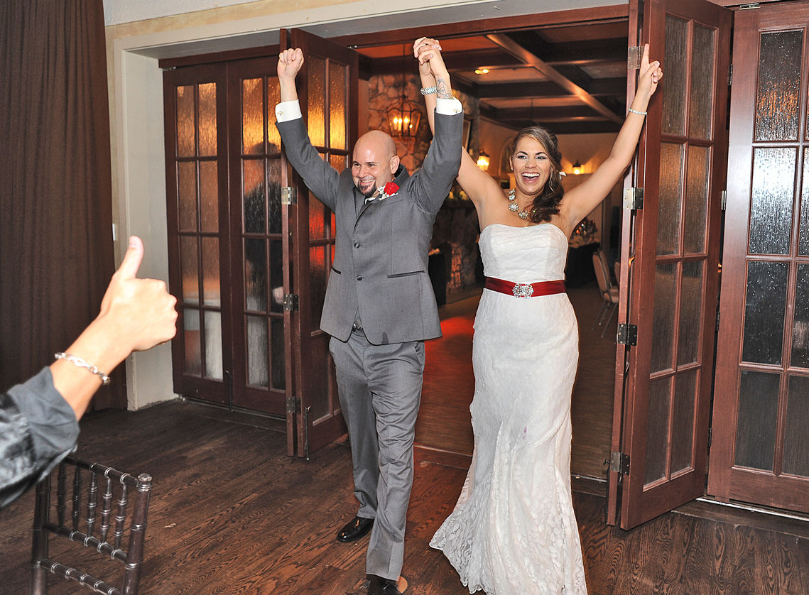 wedding couple entering the reception room